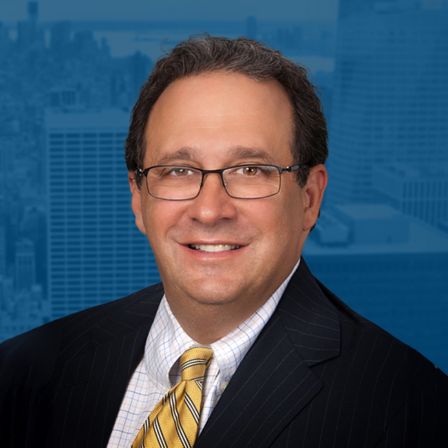 Stephen Bilkis with the New York Skyline in the background